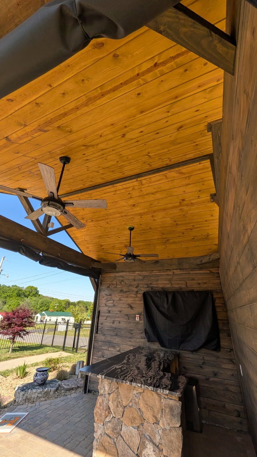 Finished gazebo interior with uniform Cabot® semi-transparent honey-toned ceiling and custom-colored walls