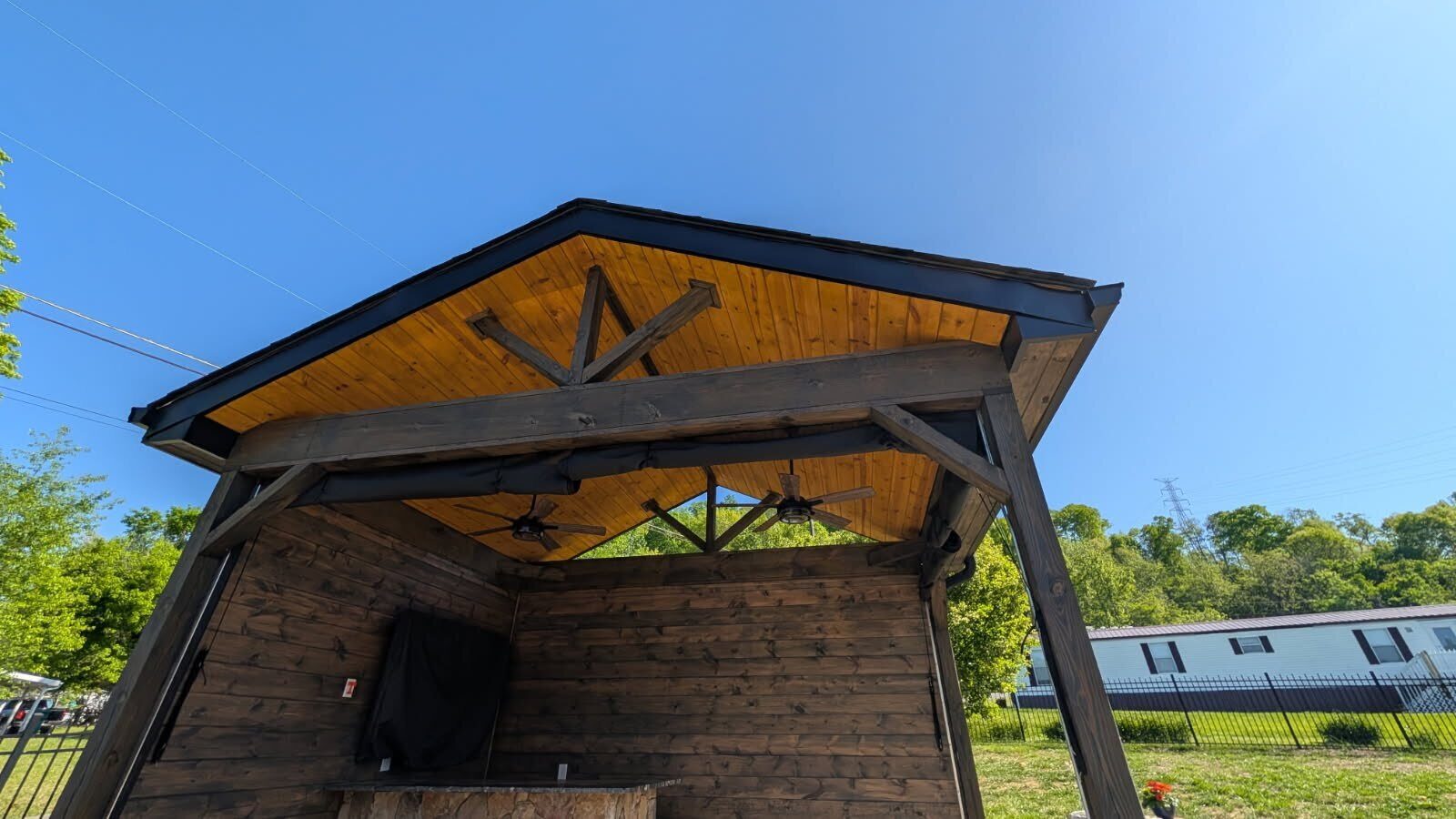 Wide exterior shot of finished Tri-Cities gazebo with stained ceiling and custom wall color