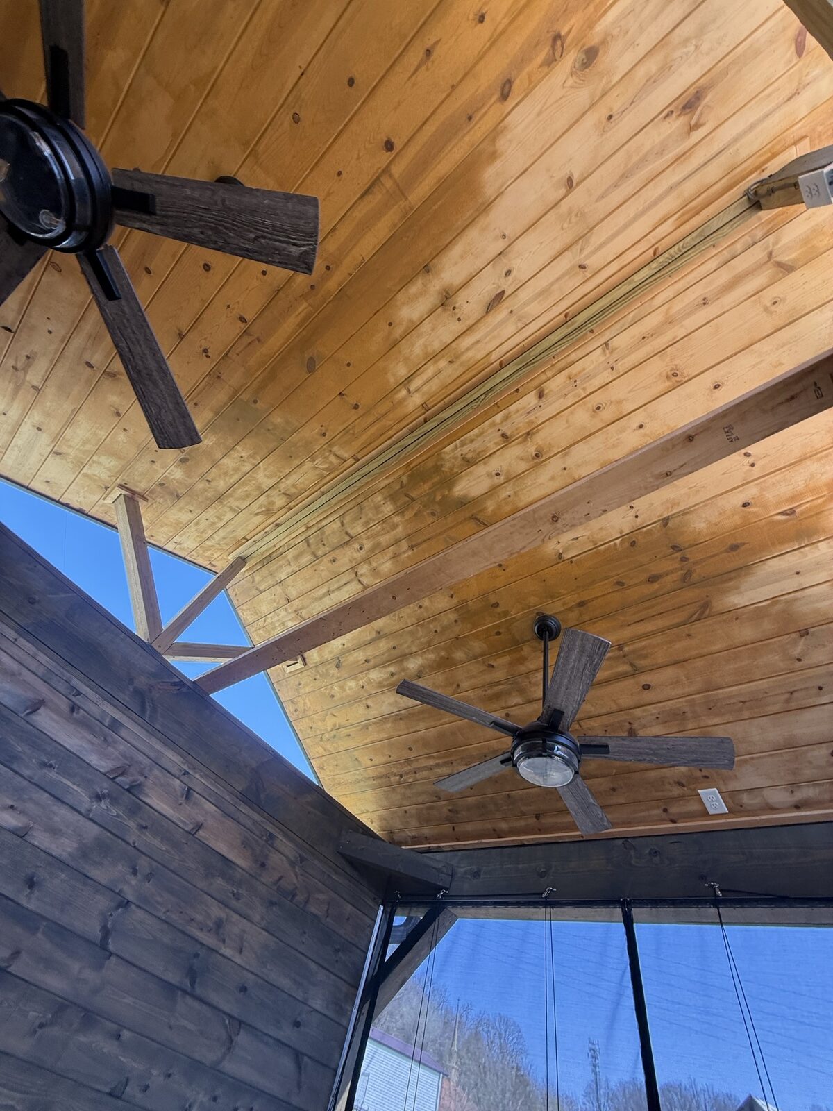 Gazebo ceiling before — over-applied semi-transparent stain showing drip marks and uneven coverage