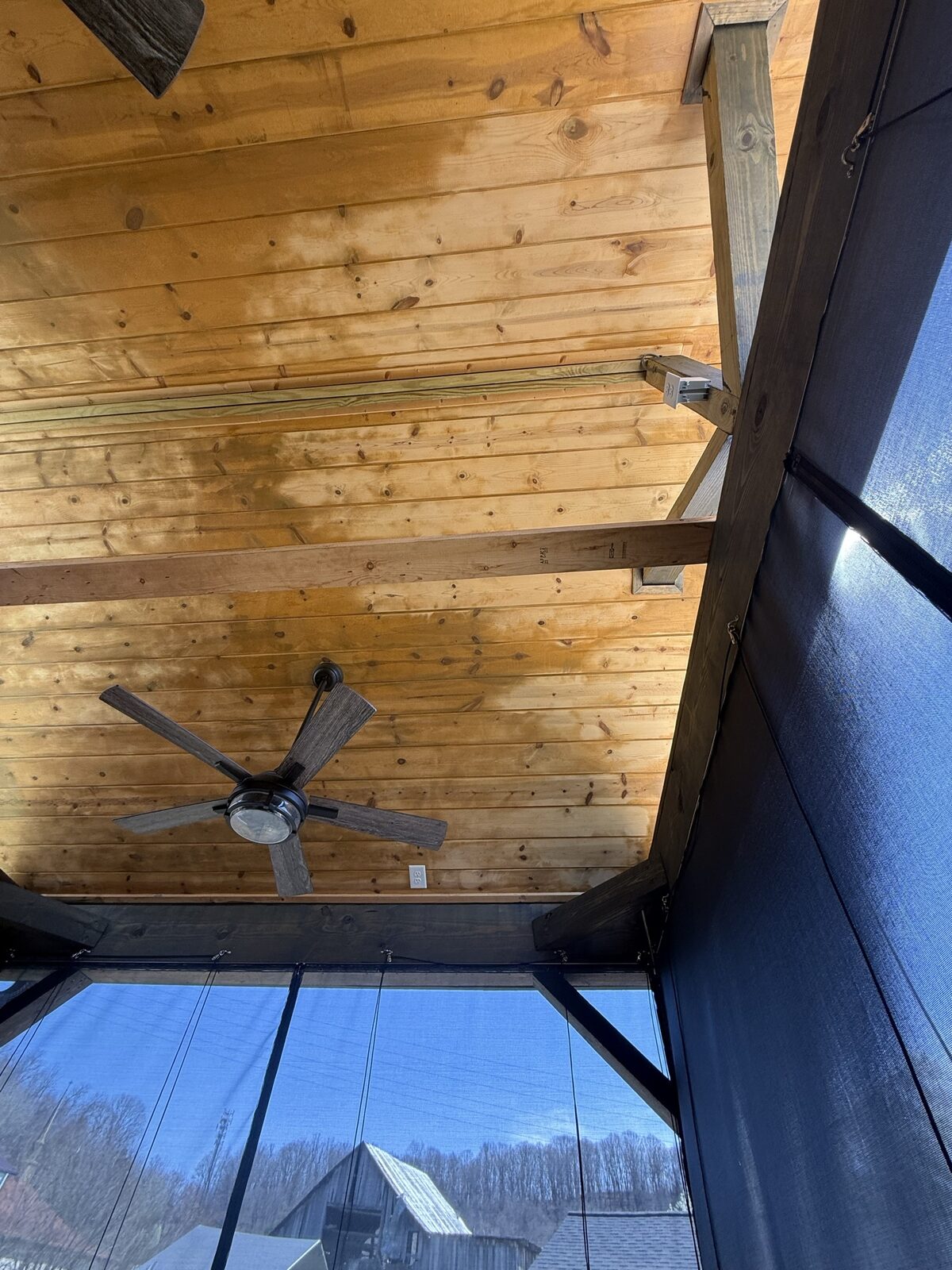 Different angle showing visible drip marks and uneven semi-transparent stain on gazebo ceiling