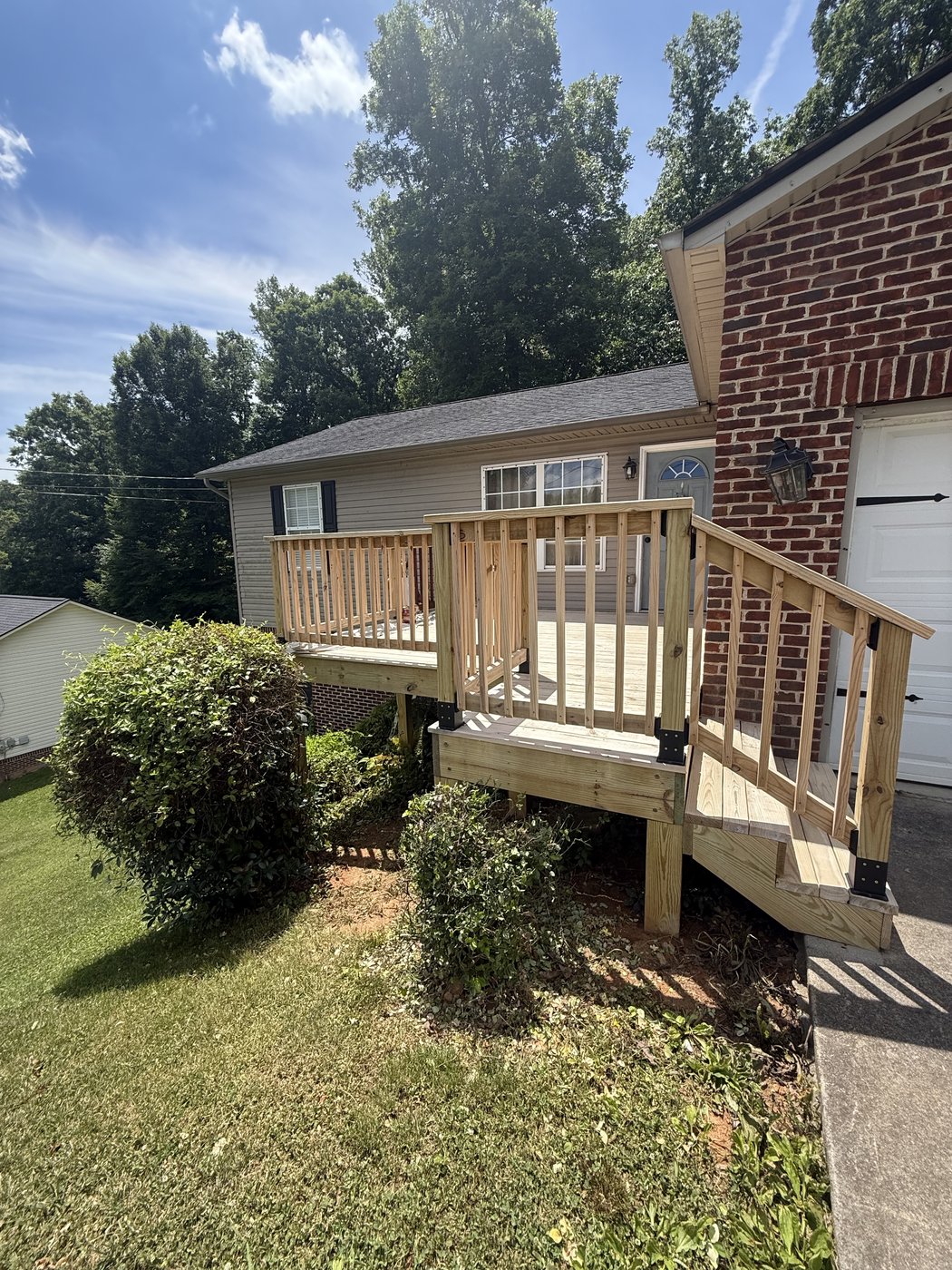 Bare pressure-treated pine deck before staining with SuperDeck Exotic Timber Oil Red Mahogany — Kingsport, TN home