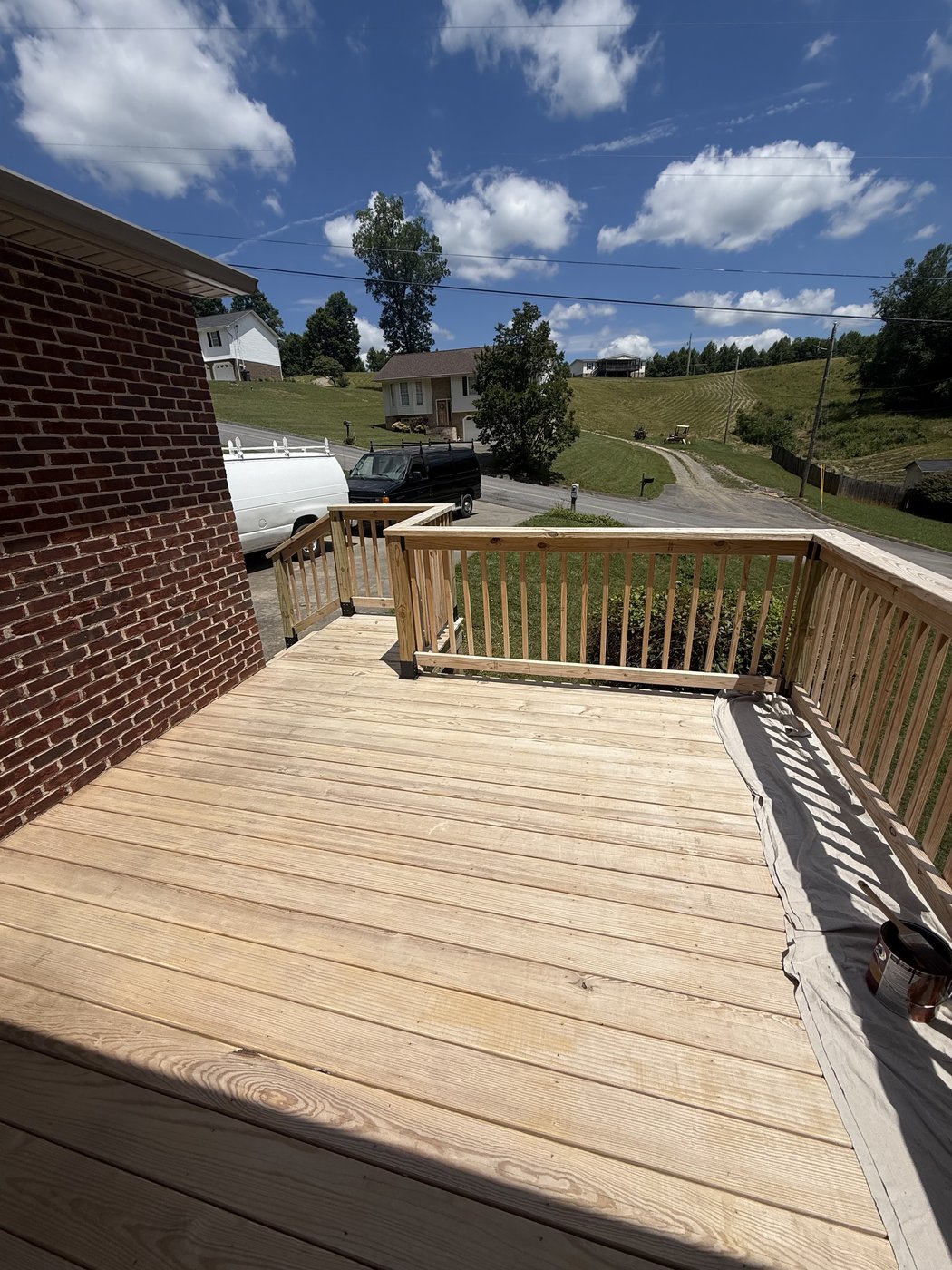 Raw pressure-treated pine deck boards before SuperDeck Exotic Timber Oil Red Mahogany