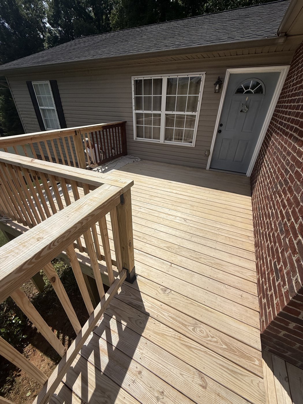 Pressure-treated pine deck and door before SuperDeck Exotic Timber Oil staining