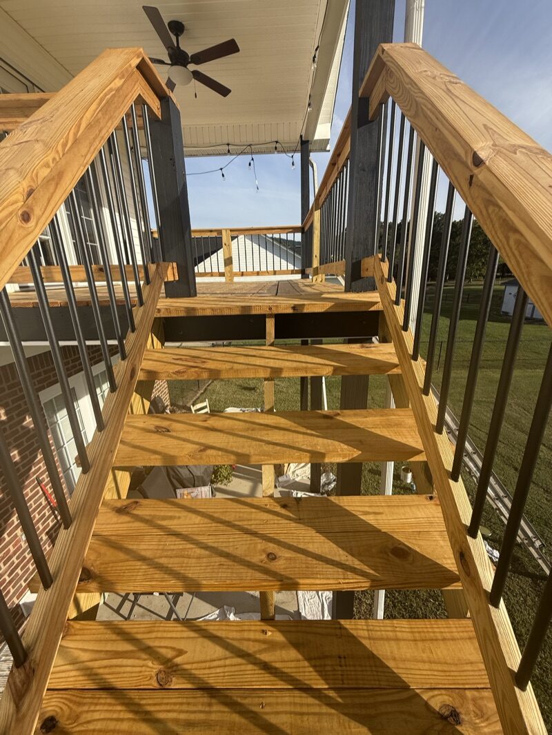 Stained pergola and deck woodwork with rich golden finish